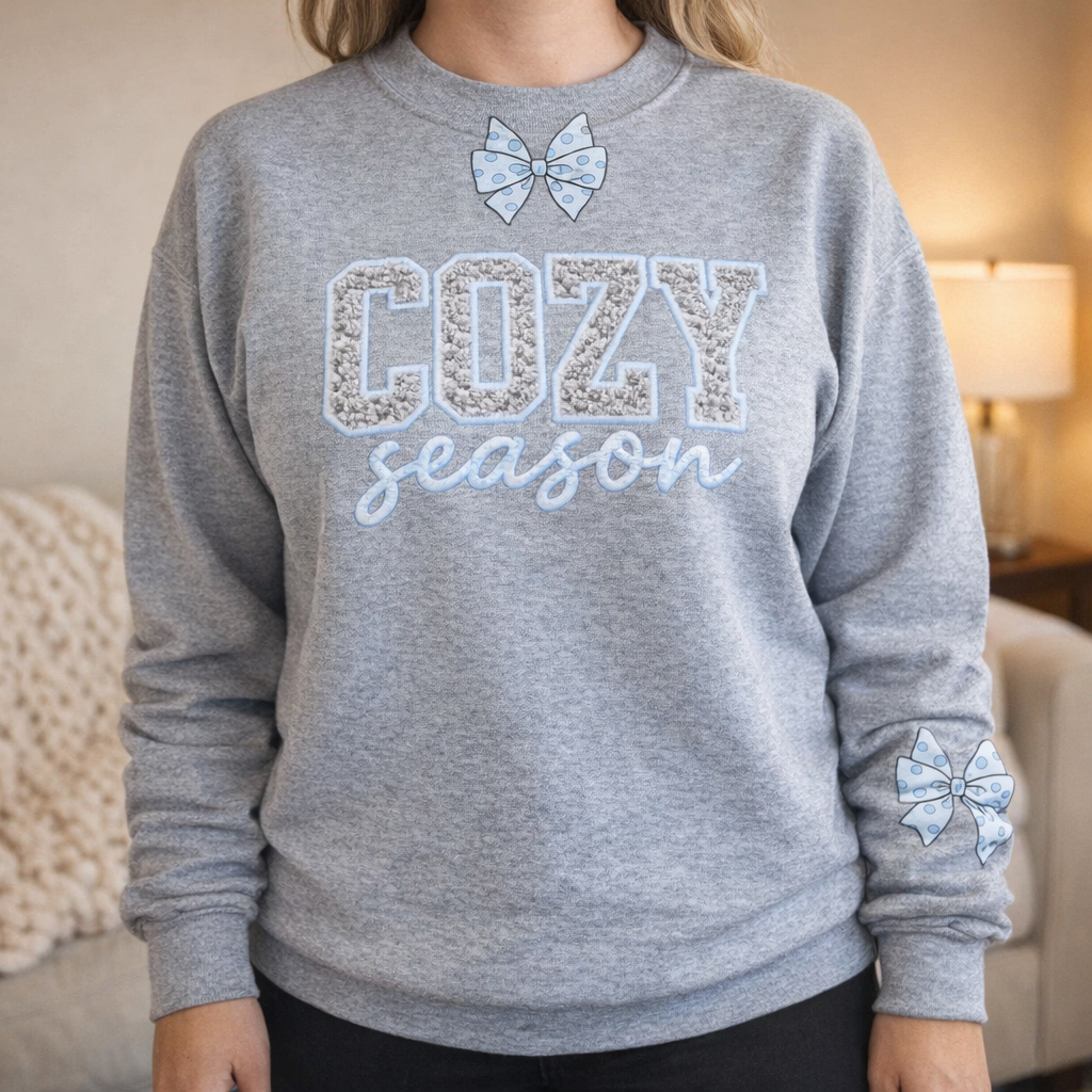 Woman wearing the Cozy Season Bow Sweatshirt in heather gray